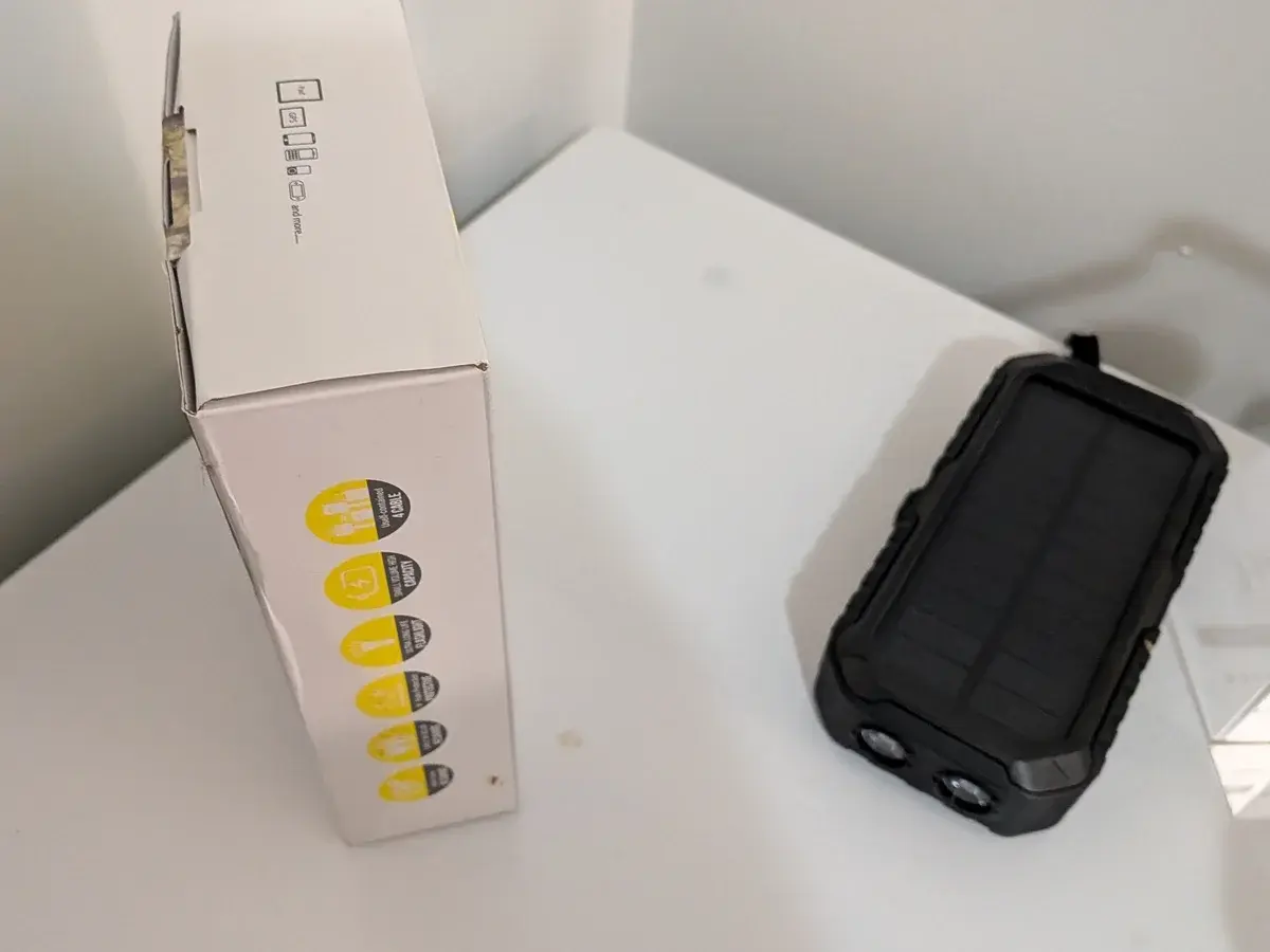 SideKick PowerBank and its product box shown at a useful portable scale